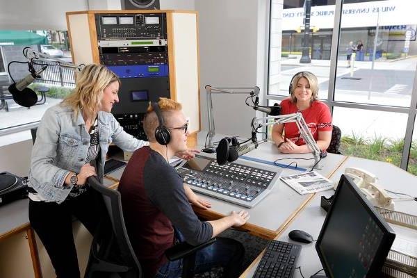 Professor Kristen Rock and students record a radio show for WCLH